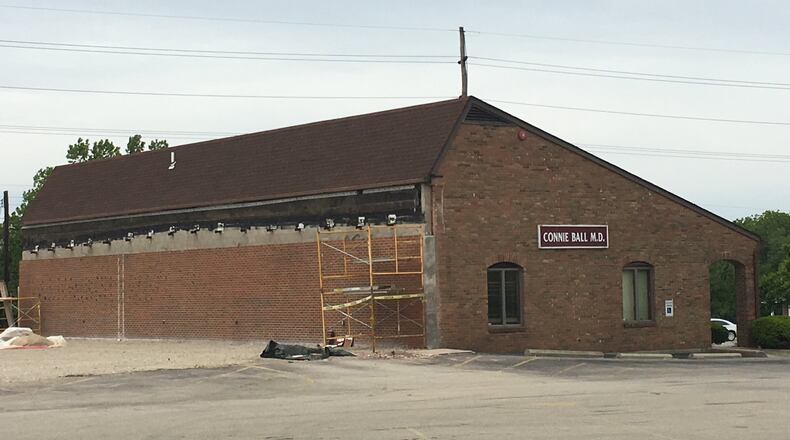 Dr. Connie Ball’s office was in the Springboro IGA Plaza before demolition for the Wright Station redevelopment. The building’s back wall was damaged during demolition of other parts of the shopping plaza demolished for the project. STAFF PHOTO BY LAWRENCE BUDD