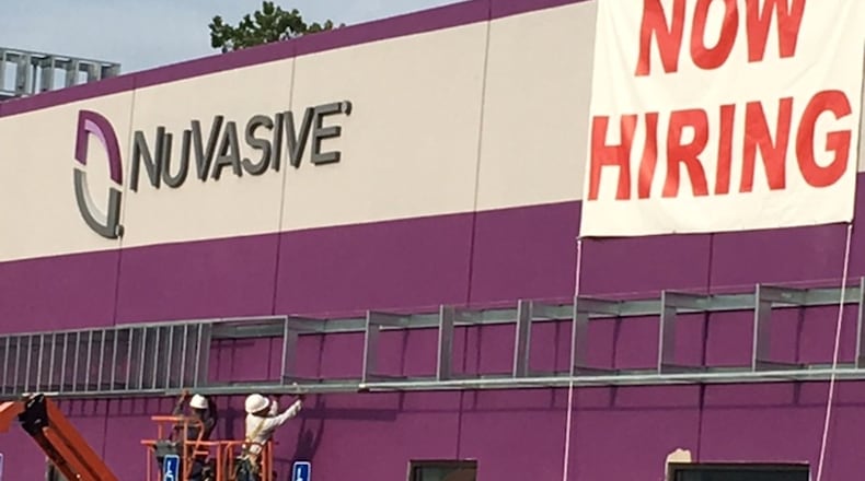 NuVasive Inc., which announced a move from Fairborn to West Carrollton in late 2015 as part of a $45 million expansion, is looking to hire for at least 30 positions for area operations. NICK BLIZZARD/PHOTO