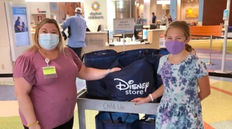 Weller Elementary School fourth-grader Gretchen Beecroft bought $3,000 in gifts for young Dayton and Cincinnati hospital patients. CONTRIBUTED