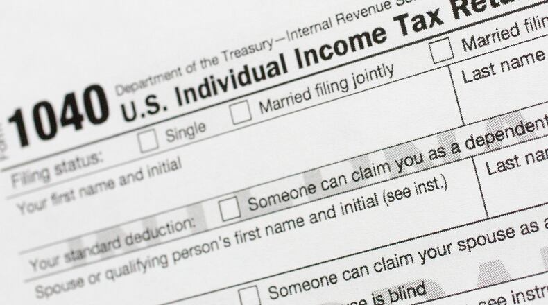FILE - This July 24, 2018, file photo shows a portion of the 1040 U.S. Individual Income Tax Return form. It’s the time of year to start thinking about taxes - what's ahead and what can be done now to manage. But the upcoming tax filing season is going to be trickier for many Americans due to rampant unemployment, working from home and general upheaval due to COVID-19. (AP Photo/Mark Lennihan, File)