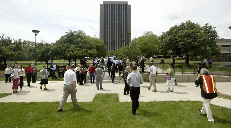 Workers are pictured outside the Montgomery County Administration Building in Dayton.