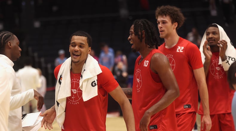 Dayton players, including De'Shayne Montgomery, front left, leave the court after an exhibition game against Penn State on Sunday, Oct. 19, 2025, at UD Arena. David Jablonski/Staff