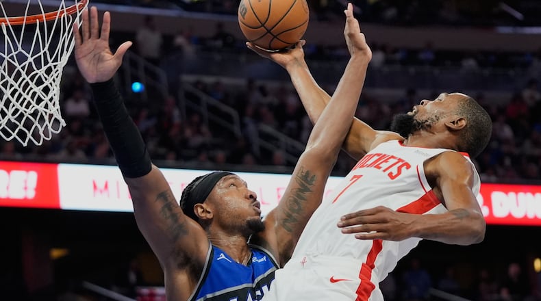 Houston Rockets forward Kevin Durant, right, goes to the basket against Orlando Magic center Wendell Carter Jr. during the second half of an NBA basketball game, Thursday, Feb. 26, 2026, in Orlando, Fla. (AP Photo/John Raoux)