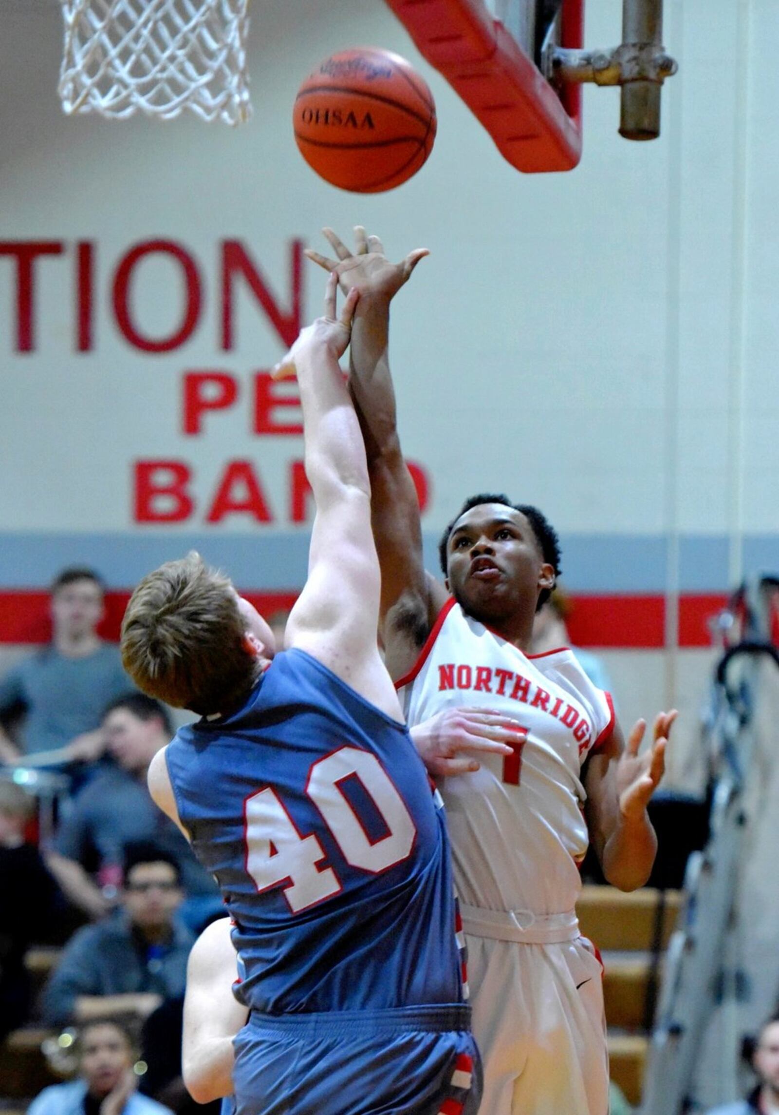 Carlisle’s Logan Baker goes after a shot by Northridge’s Namon Crowder during Friday night’s game in Dayton. NICK GRAHAM/STAFF