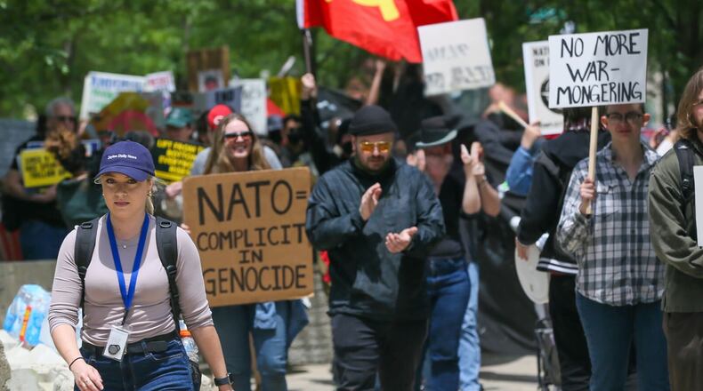 Digital Product Manager Sarah Cavender covering NATO protesters on May 25. STAFF / GREG LYNCH.