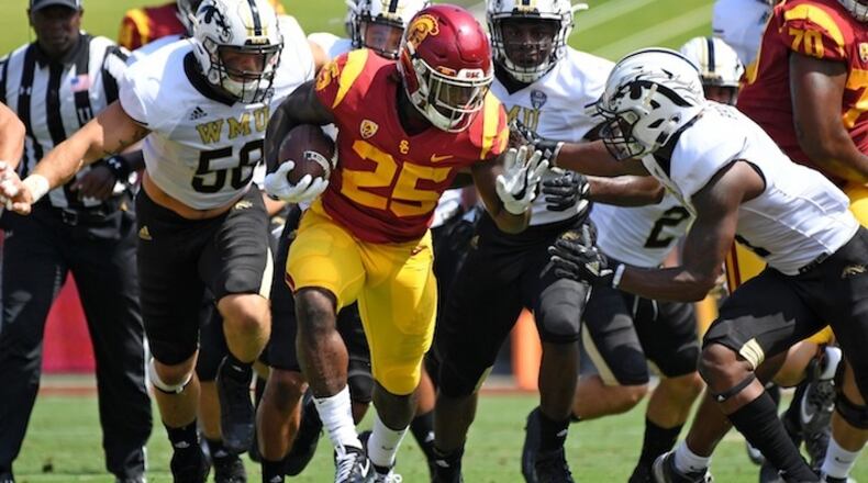 USC running back Ronald Jones (25) picks up big yards against the Western Michigan defense at the Los Angeles Memorial Coliseum on September 2, 2017. (Wally Skalij/Los Angeles Times/TNS)