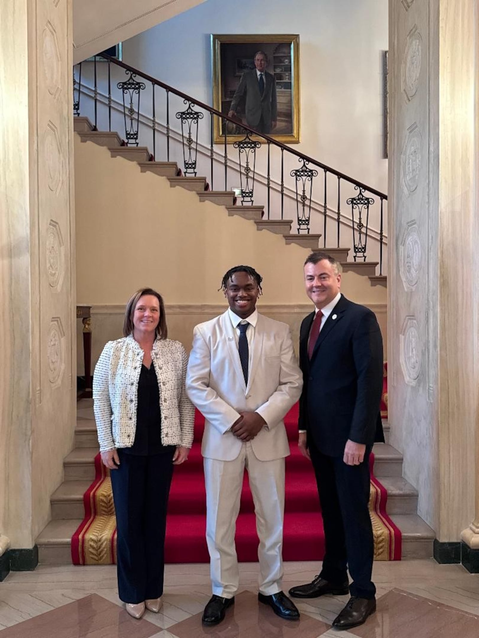From left: Lisa Carlin, Jordan Deaton and Jeff Van Deusen at the White House. CONTRIBUTED