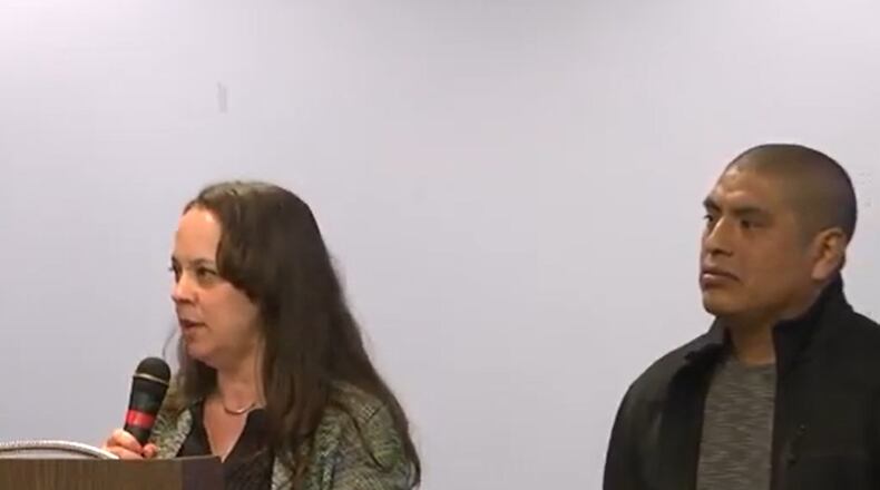 Jennie Valdez, speaking, and her husband, Andres Valdez, speak on the importance of having a central school for English language learners. Courtesy of Dayton Public Schools.