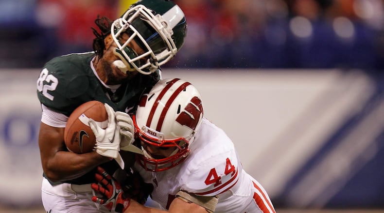 Wisconsin linebacker Chris Borland makes a hit. GETTY IMAGE