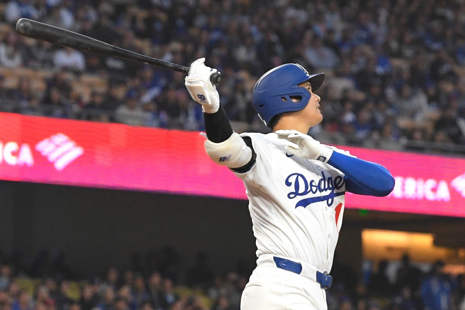 Los Angeles Dodgers' Shohei Ohtani watches his ball go out for a solo home run during the first inning of a baseball game against the Colorado Rockies Wednesday, April 16, 2025, in Los Angeles. (AP Photo/Mark J. Terrill)