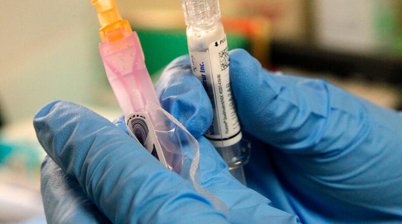 State health officials recommend getting the flu shot before the holiday season begins. So far this year, 13 people from Montgomery County have been hospitalized because of the flu, according to state data. FILE PHOTO