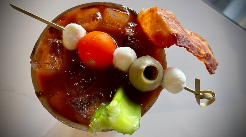 The Garden Grille & Bar is located on the second floor of the Hilton Garden Inn Dayton Downtown at 18 W. Third St. Pictured is the Bacon Balsamic Bloody Mary. NATALIE JONES/STAFF