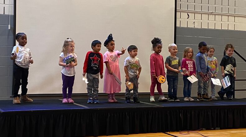 Children who attend Stepping Stones Learning Center, a Preschool Promise site, performed songs for the people who attending a Preschool Promise lunch on Tuesday. Eileen McClory / Staff