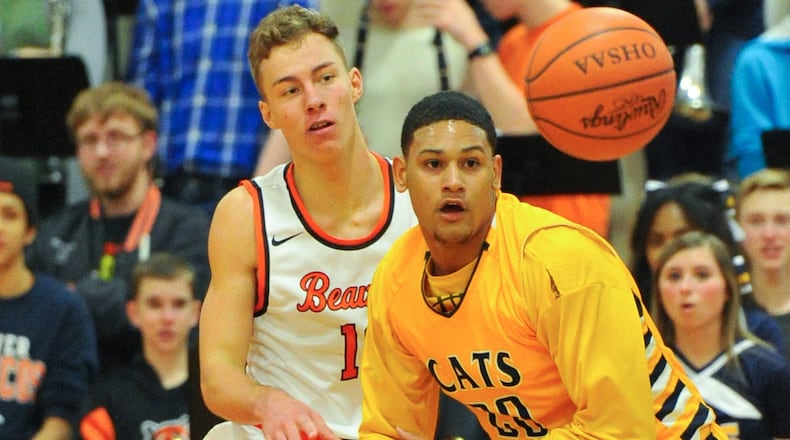 Beavercreek’s Jon Alessandro (left) and Springfield’s Leonard Taylor (right) can’t secure a loose ball. Beavercreek defeated visiting Springfield 70-69 in OT in a boys high school basketball game on Dec. 9, 2016. BRYANT BILLING / CONTRIBUTED
