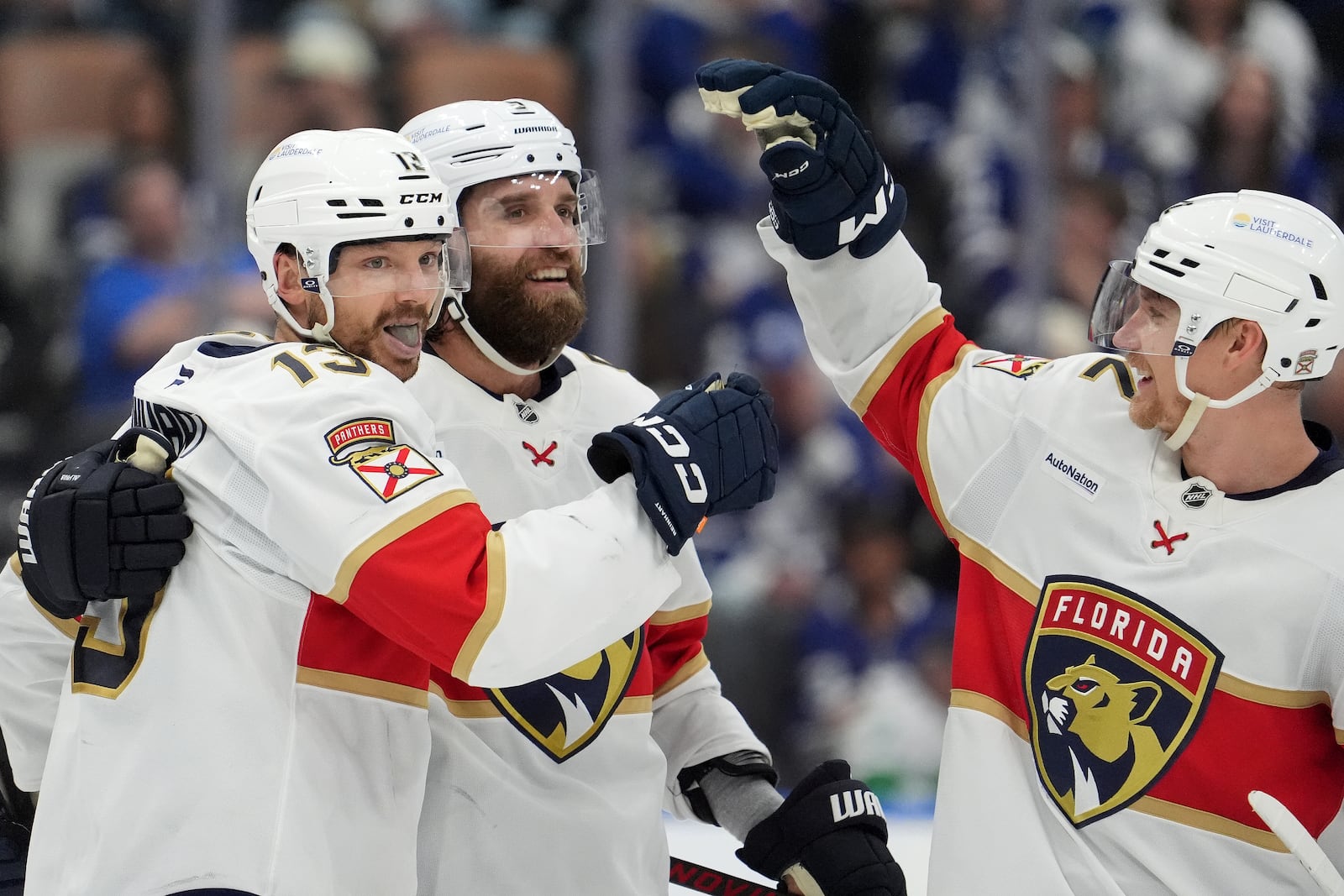 Florida Panthers centre Sam Reinhart (13) celebrates his goal with teammates Aaron Ekblad (5) and Gustav Forsling (42) during the third period of Game 7 of a second-round NHL hockey playoff series in Toronto, Sunday, May 18, 2025. (Frank Gunn/The Canadian Press via AP)