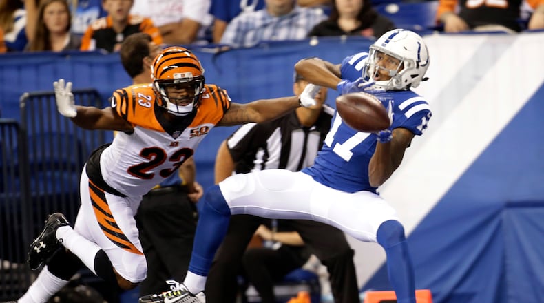 Indianapolis Colts wide receiver Justice Liggins (17) makes a catch in front of Cincinnati Bengals cornerback Bene Benwikere (23) for a touchdown during the second half of a preseason NFL football game in Indianapolis, Thursday, Aug. 31, 2017. (AP Photo/AJ Mast)