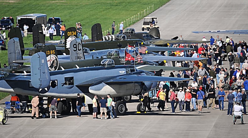 Spectators flocked to B-25s that landed at Wright-Patterson Air Force Base on Tuesday, April 18, 2017. The planes came to the National Museum of the U. S. Air Force as part of a celebration of the 75th anniversary of the Doolittle Raiders mission against Japan. MARSHALL GORBY / STAFF
