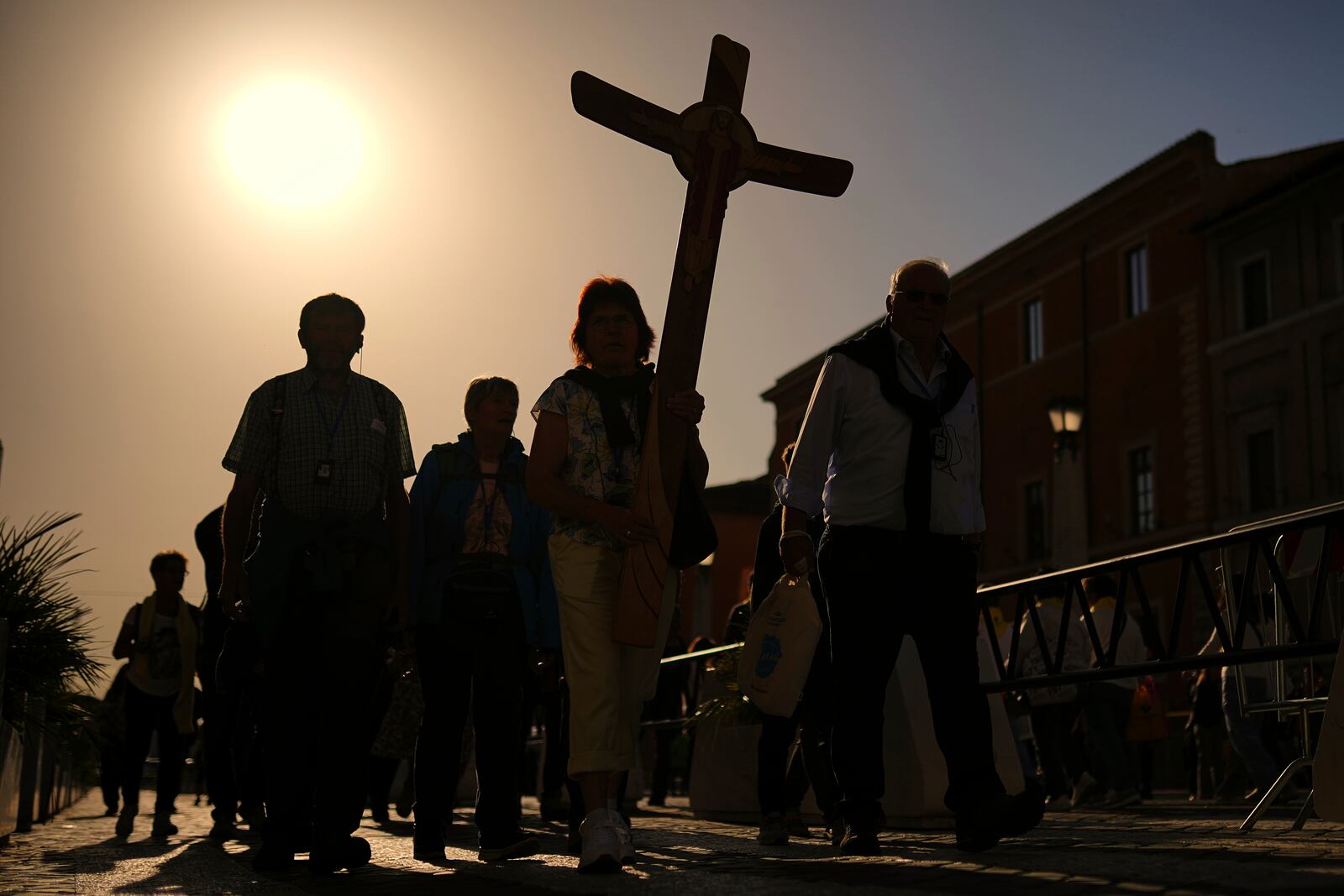 Pilgrims arrive in St. Peter's Square at the Vatican, Tuesday, April 22, 2025. (AP Photo/Francisco Seco)