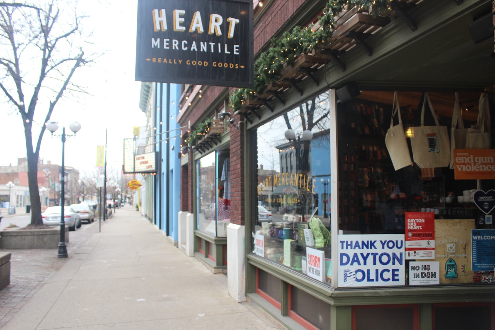Six months after a 24-year-old Bellbrook man killed nine people in the Oregon District during the worst mass shooting in Ohio history, literal signs of strength, appreciation, resilience and the determination to “do something” about gun violence can be found throughout the historic neighborhood. Heart Mercantile displays a "Thank you Dayton Police" sign.  AMELIA ROBINSON/STAFF