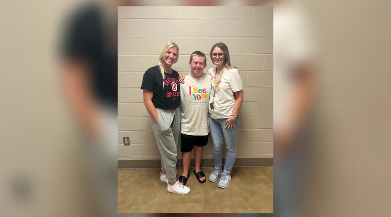 Olivia Taylor, left, is president and Andy Turner, center, is director of Best Buddies at Miamisburg High School. They are shown with their teacher and advisor, Amanda DiGiovanna, who helped Taylor create the program at Miamisburg High School three years ago. CONTRIBUTED
