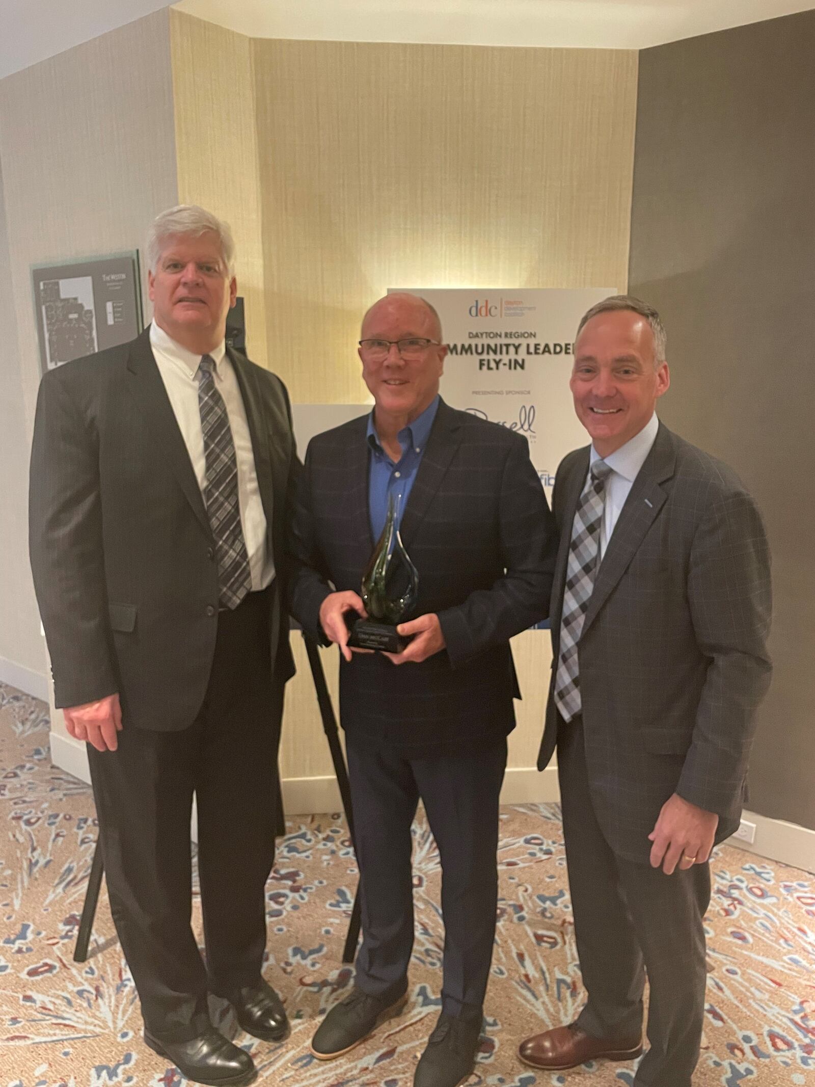Dave McCabe, center, recently retired chief of staff for CareSource, with with Jeff Hoagland (right), the Dayton Development Coalition president and chief executive, and Doug Compton (left), the coalition's board chair. Contributed