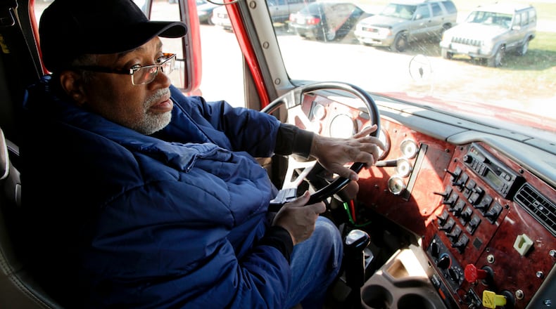 Albert Dammons, from Dayton, drives the obstacle course at Ohio Business College Truck Driving Academy in Madison Twp., Ohio Thursday, November 15, 2012. Trucking jobs are one of the fastest growing jobs in the country, and there is a shortage in drivers. GARY STELZER / STAFF