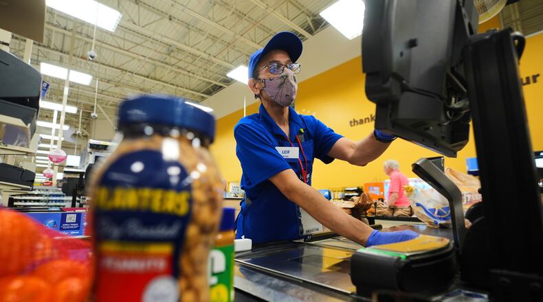 FILE -A cashier rings up groceries in Dallas, Aug. 28, 2025. (AP Photo/LM Otero, File)
