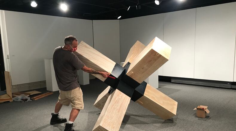Landon Crowell installs his sculpture for Rosewood Arts Centre’s current “HWD (height, width, depth) Sculpture Exhibition 2020.” CONTRIBUTED