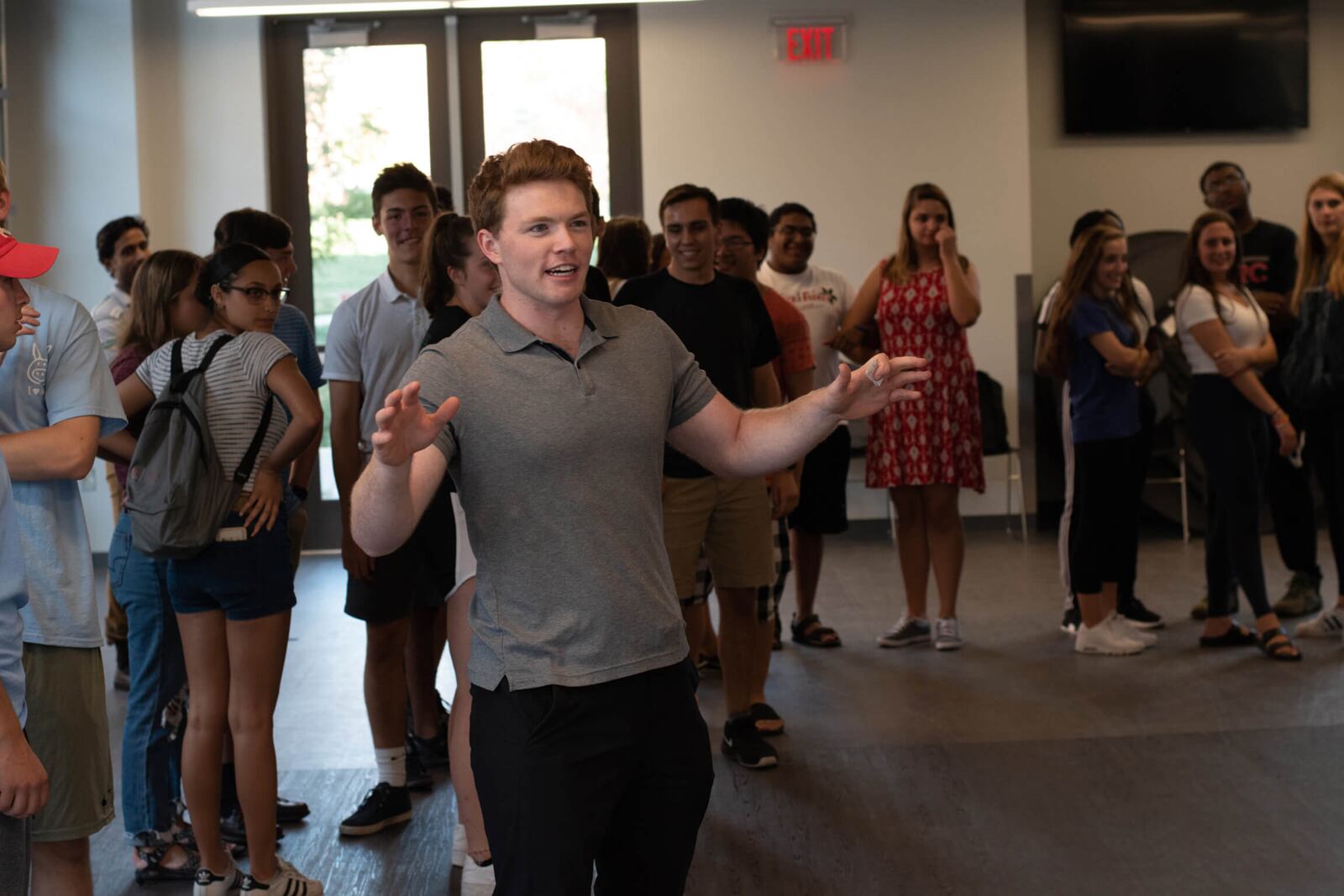 Nathan Minns decided he wanted to learn to do improv while in college. He turned the skills he learned into a business and now teaches groups through his company, Green Light Improv. He is shown facilitating a workshop at Ohio State University.
