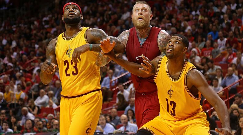 MIAMI, FL - DECEMBER 25: LeBron James #23 and Tristan Thompson #13 of the Cleveland Cavaliers box out Chris Andersen #11 of the Miami Heat during a game at American Airlines Arena on December 25, 2014 in Miami, Florida. NOTE TO USER: User expressly acknowledges and agrees that, by downloading and/or using this photograph, user is consenting to the terms and conditions of the Getty Images License Agreement. Mandatory copyright notice: (Photo by Mike Ehrmann/Getty Images)
