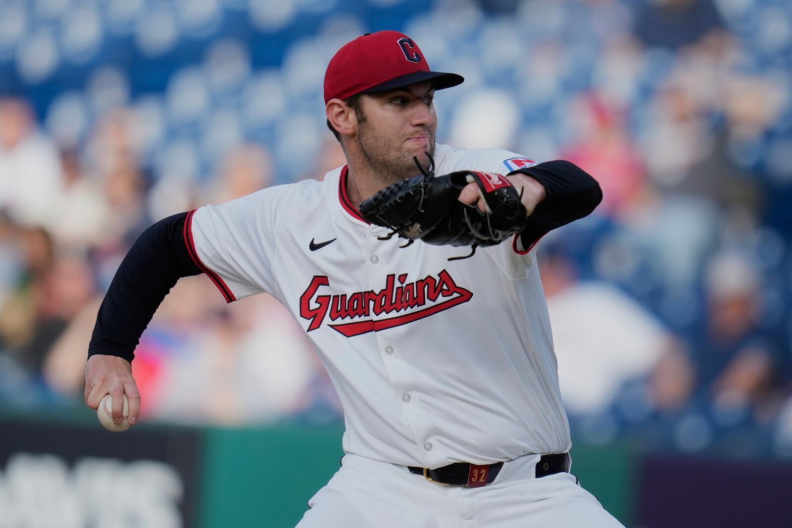 Cleveland Guardians' Gavin Williams pitches in the first inning of a baseball game against the Minnesota Twins in Cleveland, Monday, April 28, 2025. (AP Photo/Sue Ogrocki)