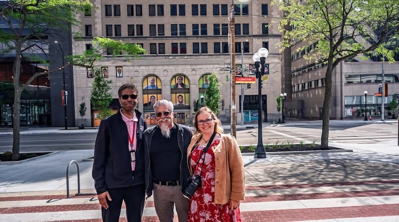 Photographer SarahLydia Kiehl poses next to graphic designers John Stoddard (Center) and Stewart Halfacre (far left). CONTRIBUTED