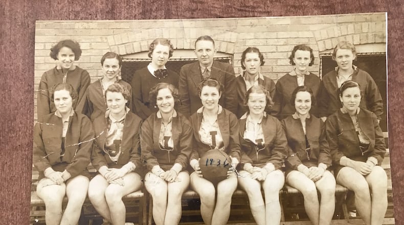 Iola Burr (seated center holding ball) with her Jefferson Township Consolidated High School girls basketball team in 1936. At 5-foot-7 ½ she was team’s tallest player and jumped center. Her sister Martha, a freshman guard, is seated on the far right. Rules were different then. Girls were relegated to a position on one half of the court or the other and you were allowed just one dribble. Jefferson Township played girls teams at seven other Greene County high schools. Four years after this photo was taken, the Ohio High School Athletic Association – after a 2 to 1 vote by schools in the state – dissolved all girls basketball programs because the sport was thought to be “too robust” for girls. The ban lasted 25 years. CONTRIBUTED