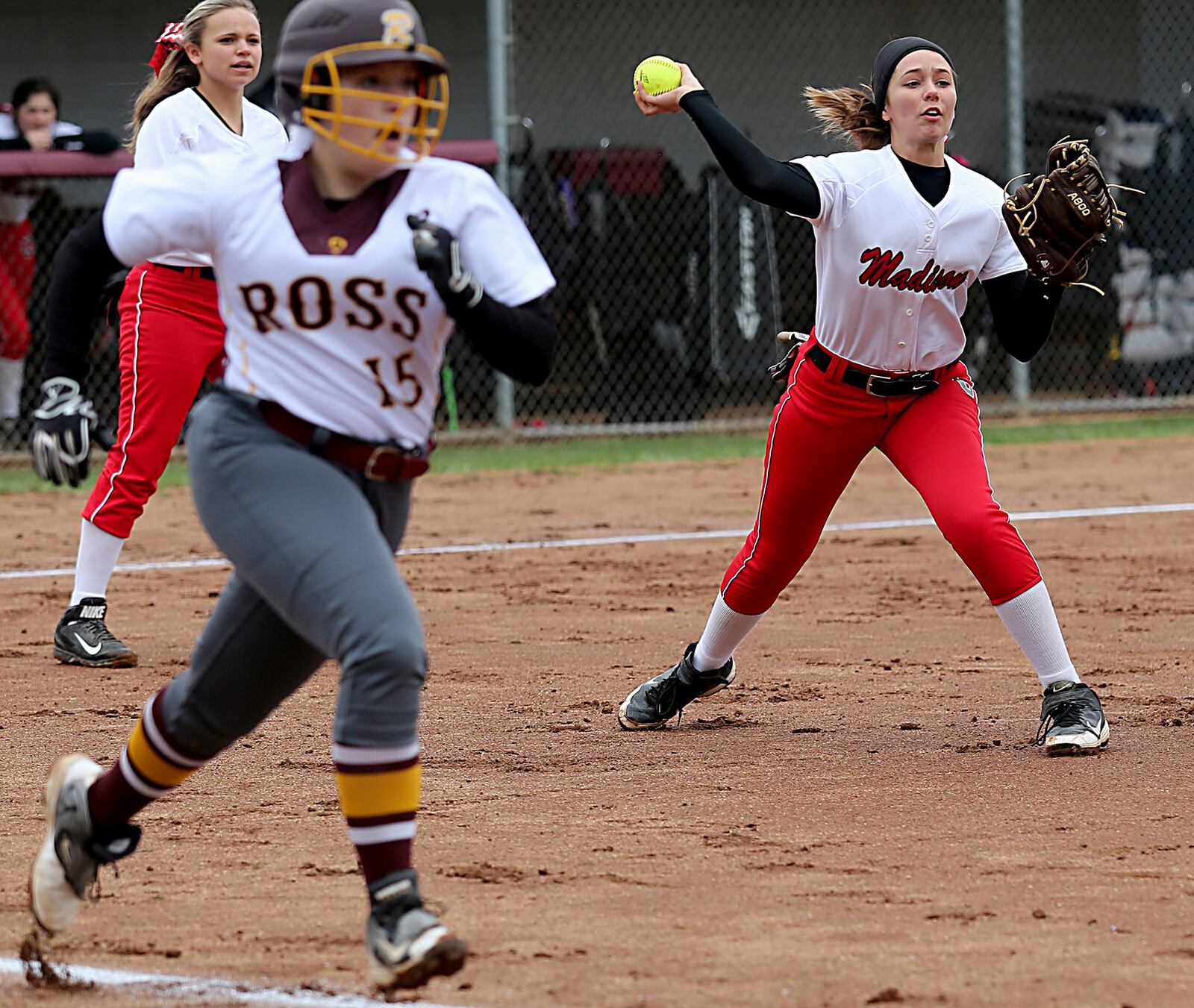 Madison shortstop Jenna O’Hair makes the throw to first to get the out on Whitley Arno (15) of Ross during Saturday’s contest at RHS. CONTRIBUTED PHOTO BY E.L. HUBBARD