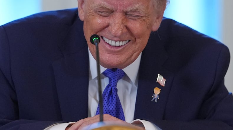 President Donald Trump laughs during a meeting with oil executives in the East Room of the White House, Friday, Jan. 9, 2026, in Washington. (AP Photo/Evan Vucci)