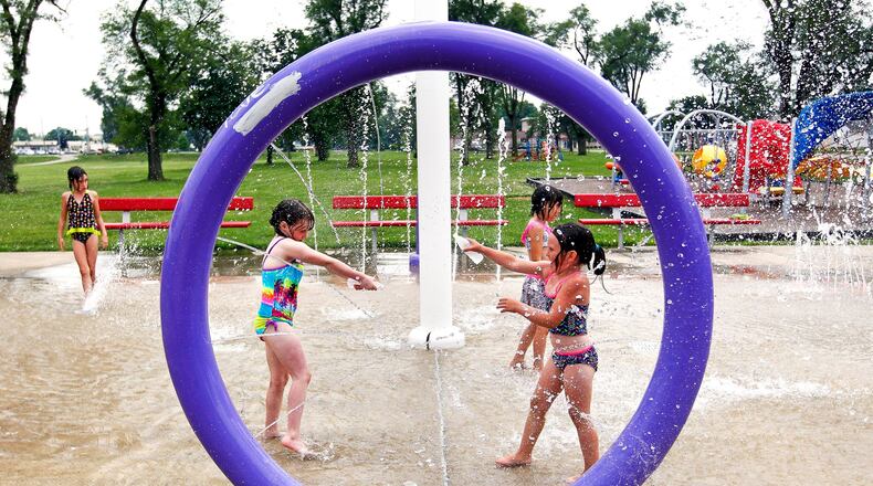 Children splash at the Douglass Park Splash Pad in Middletown. STAFF FILE PHOTO