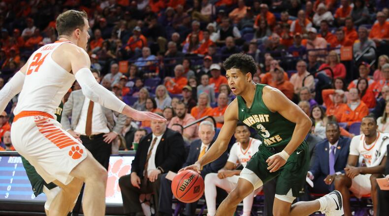 Wright State’s Mark Hughes drives against Clemson’s David Skara during Tuesday’s NIT game at Littlejohn Coliseum. CONTRIBUTED