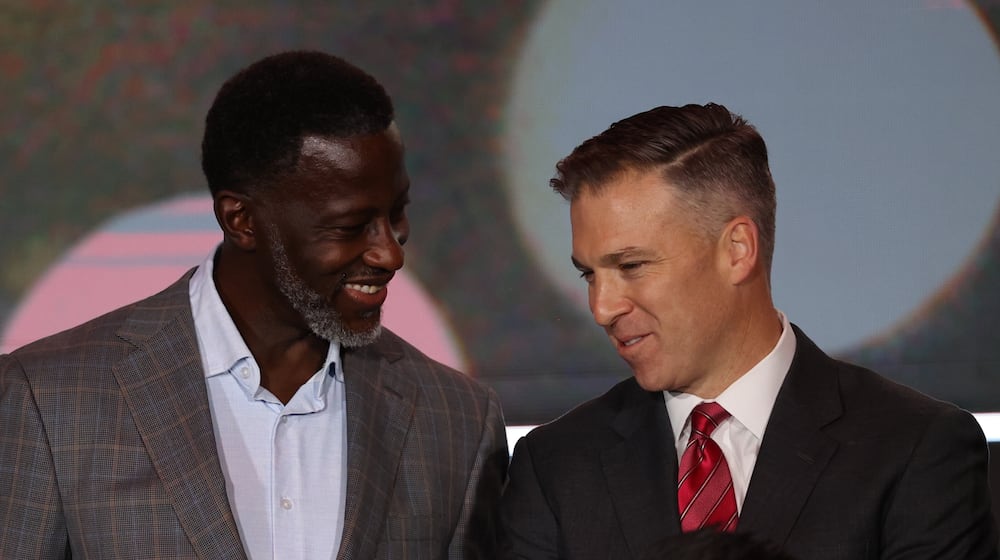 Dayton's Anthony Grant talks to Davidson's Matt McKillop at Atlantic 10 Conference Media Day on Tuesday, Sept. 30, 2025, in Pittsburgh. David Jablonski/Staff