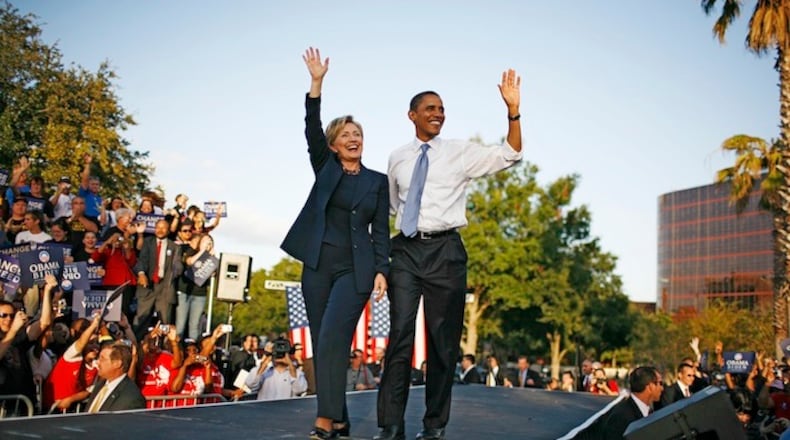 FILE -- Then Senators Barack Obama and Hillary Clinton at a presidential campaign rally, after Obama had clinched the Democratic nomination, at Amway Arena in Orlando, Fla., Oct. 20, 2008. Advisers say that Obama, who sees a Democratic successor as critical to his legacy, is impatient to begin campaigning for Hillary Clinton, and will soon formally endorse her candidacy. (Damon Winter/The New York Times)