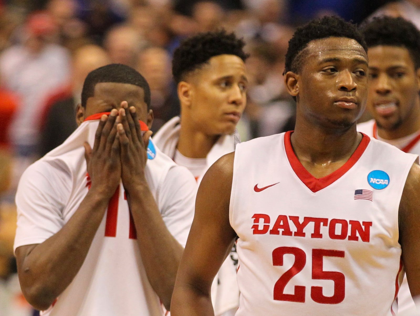 Dayton players (left to right) Kyle Davis, Scoochie Smith, Darrell Davis (back center) and Kendall Pollard leave the court after a loss against Syracuse in the first round of the NCAA tournament on Friday, March 18, 2016, at the Scottrade Center in St. Louis. David Jablonski/Staff 2016 Dayton NCAA Tournament 3.jpg