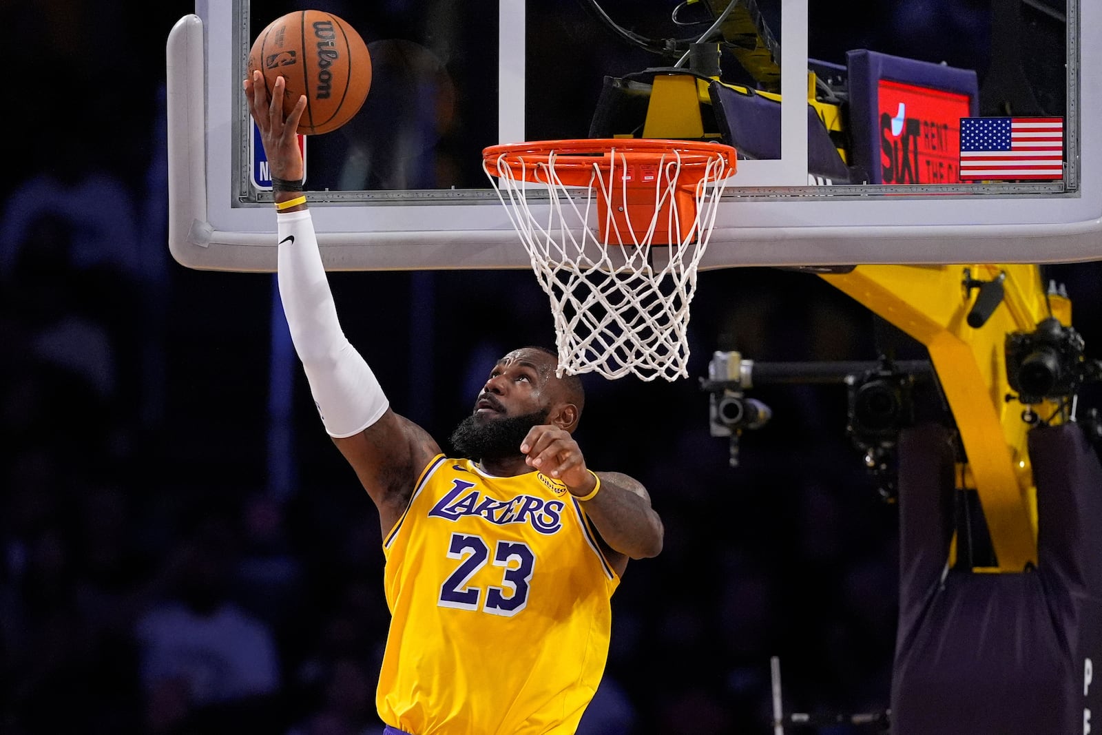 Los Angeles Lakers forward LeBron James shoots during the first half of an NBA basketball game against the Houston Rockets, Friday, April 11, 2025, in Los Angeles. (AP Photo/Mark J. Terrill)