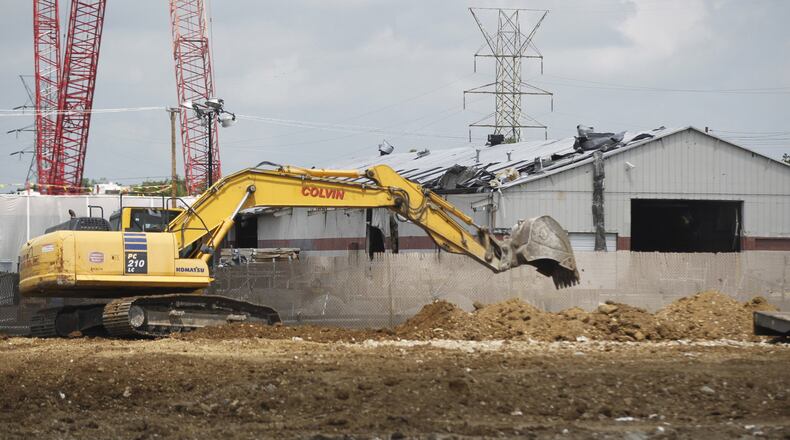 Contractors are in the final stages of demolishing the remains of the Frito Lay distribution center on Troy Street that was destroyed by the Memorial Day tornado. TY GREENLEES / STAFF