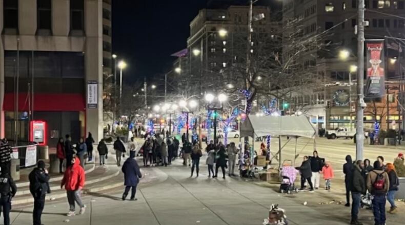 A scene from downtown Dayton after people scrambled to leave the area following a gunshot heard Friday, Nov. 25, 2022, during the Children's Parade at the Dayton Holiday Festival. ALLISON SWANSON/STAFF