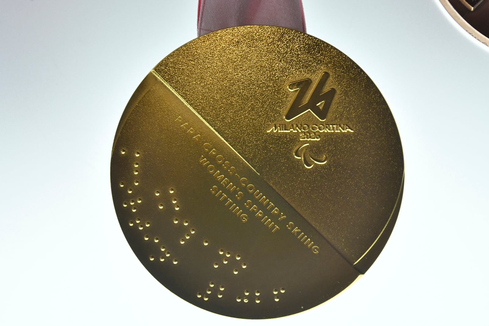 Milano Cortina 2026 Winter Paralympics Gold medal is displayed during the unveiling ceremony in Venice, Italy, Tuesday, July 15, 2025. (AP Photo/Luigi Costantini)
