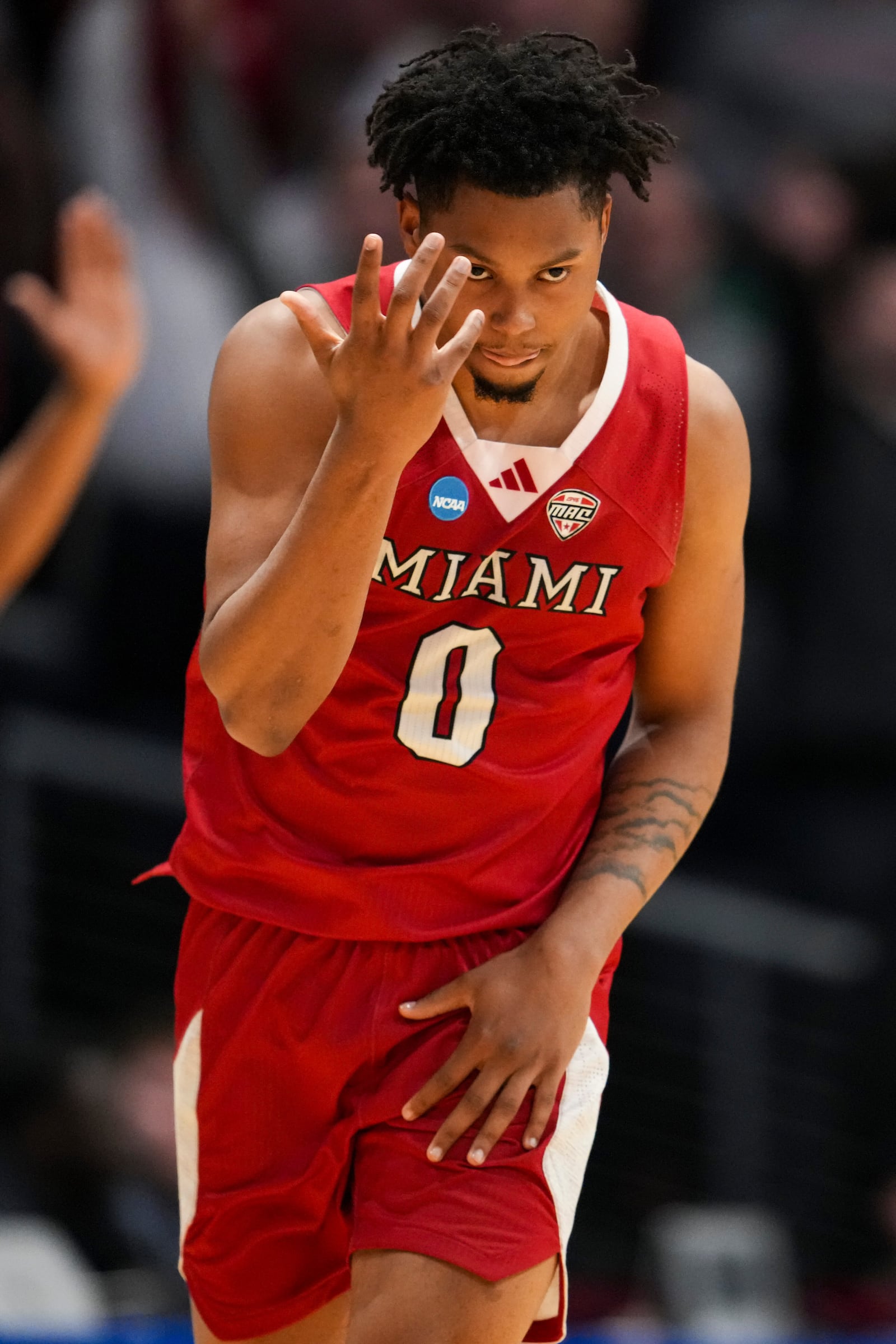 Miami (Ohio) guard Eian Elmer reacts after scoring during the first half of a First Four college basketball game against SMU in the NCAA Tournament in Dayton, Ohio, Wednesday, March 18, 2026. (AP Photo/Jeff Dean)