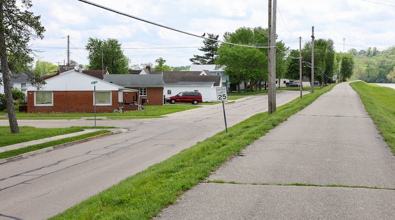 Improving access to the Great Miami River Bikeway from the neighborhoods will be a big part of the Miamisburg's Active Transportation Plan. Miamisburg officials say an example of where a simple, small-scale connection could greatly improve accessibility is this stretch along Old Main Street near Mays Avenue, which features a bike path that runs parallel to the road but sits slightly elevated without a direct link to the surrounding neighborhood. BRYANT BILLING / STAFF