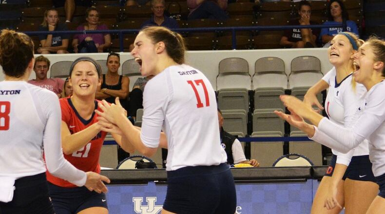 The Dayton volleyball team celebrates a point during a match against the College of Charleston on Sept. 1, 2018, at the Frericks Center in Dayton. Photo by Erik Schelkun