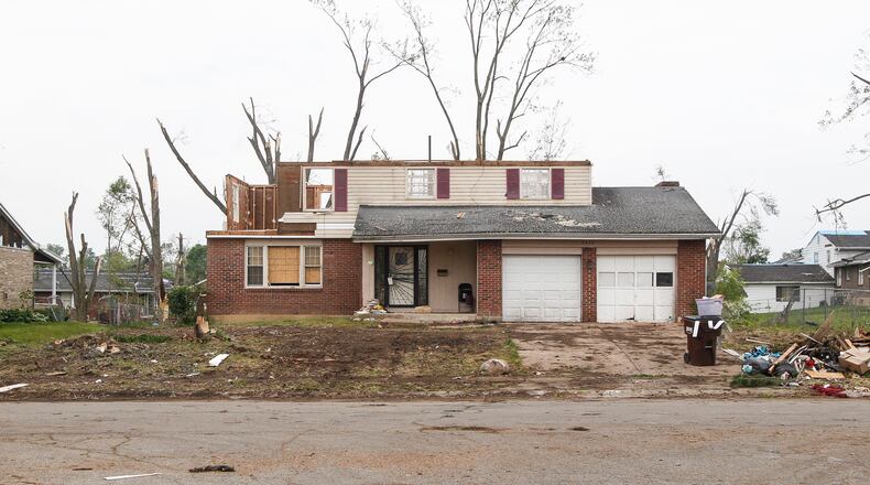 A tornado that ripped through Trotwood on Memorial Day took the roof off this Westcreek Drive house. CHRIS STEWART / STAFF