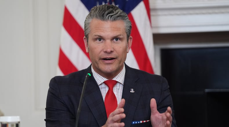 Defense Secretary Pete Hegseth answers a question from a reporter during a roundtable on criminal cartels in the State Dining Room of the White House, Thursday, Oct. 23, 2025, in Washington. (AP Photo/Evan Vucci)