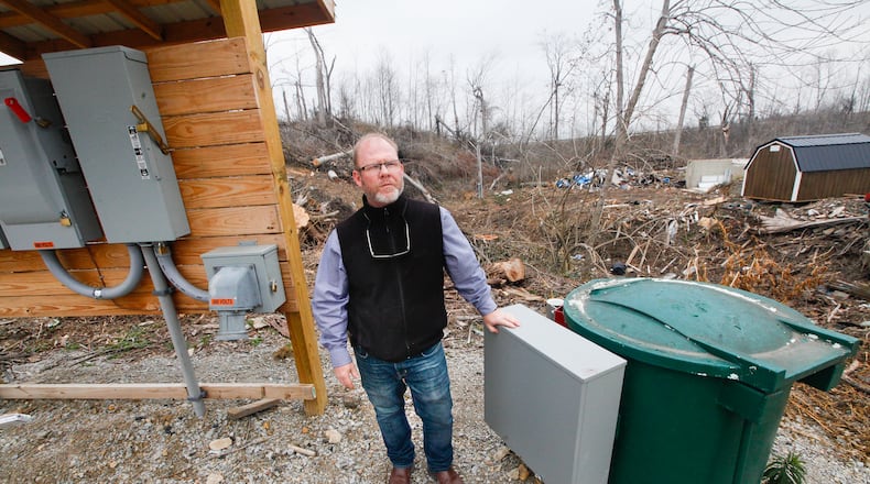 Lanny Wallace, Greene County’s utility maintenance manager, is seen at a sewer lift station on Murwood Court in Beavercreek that was damaged by a Memorial Day tornado. The county is looking to replace three lift stations that currently use electric pumps with new gravity systems. CHRIS STEWART / STAFF